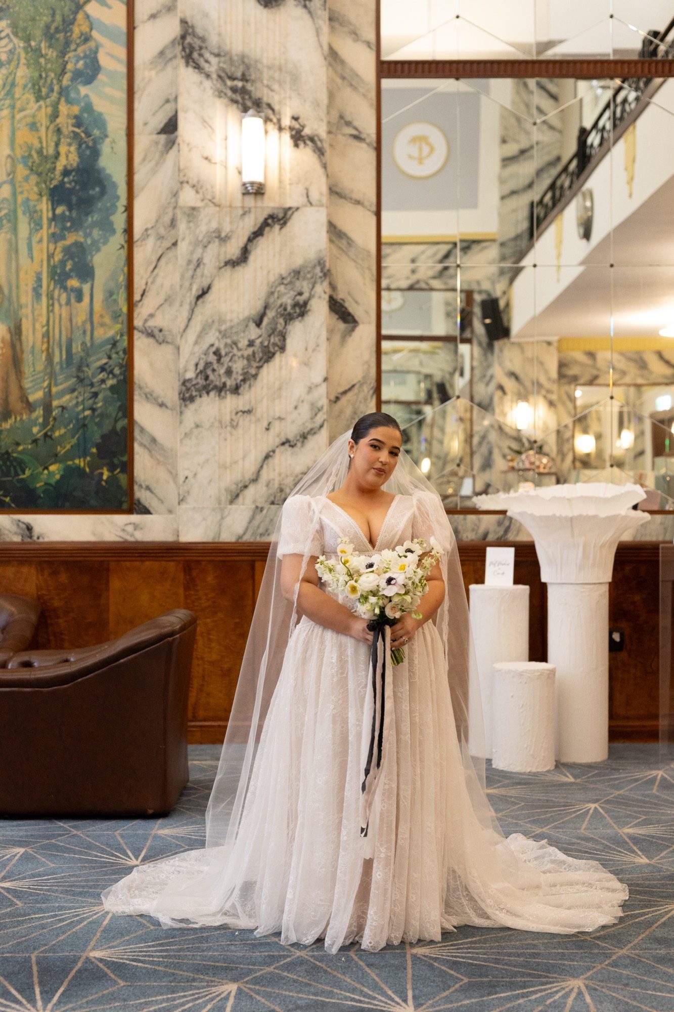 Bridal portrait with anemone bouquet and cathedral veil, Tattersall's Club Brisbane