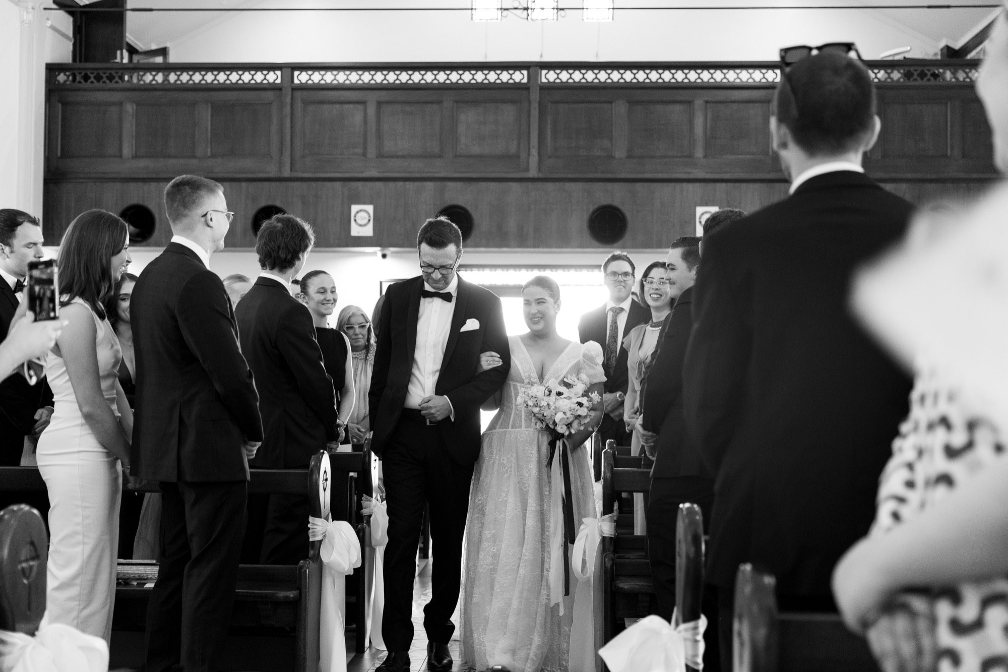 The bride walking the aisle on her father's arm, St Luke's Church, Woolloongabba